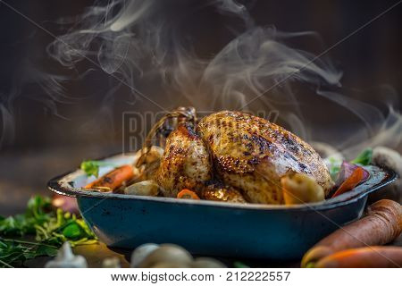Roast Whole Turkey Or  Chicken In Old Pan With Vegetables