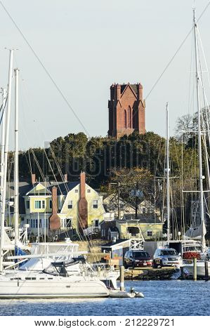 Fairhaven Massachusetts USA - November 4 2017: Tower of First Congregational Church rises above marina on Acushnet River in Fairhaven Massachusetts