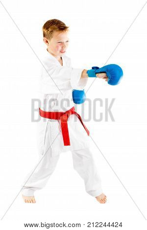 Pre-teen boy doing karate on a white background