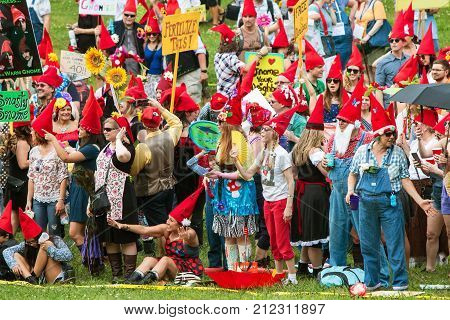 ATLANTA, GA - APRIL 2017:  A huge group of people dressed like gnomes gather at Inman Park to attempt a world record for most gnomes gathered in one place in Atlanta GA on April 29 2017.