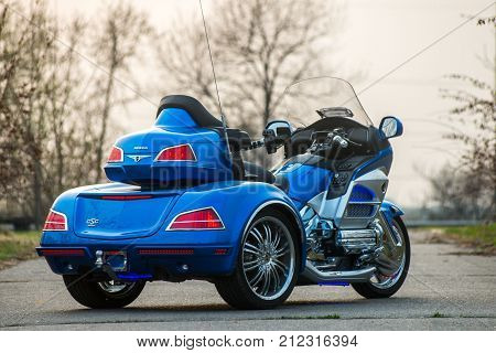 KHABAROVSK, RUSSIA - May 3, 2017: Honda Trake three-wheeled motorbike hand-assembled stands on flat ground in the street on Khabarovsk on may 3, 2017