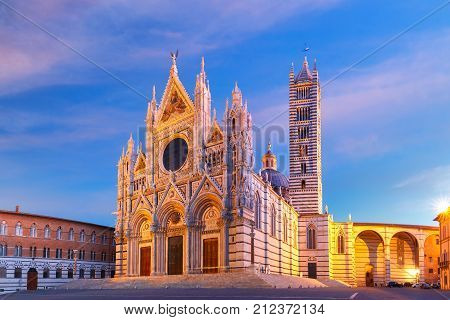 Beautiful view of facade and campanile of Siena Cathedral, Duomo di Siena at sunrise, Siena, Tuscany, Italy