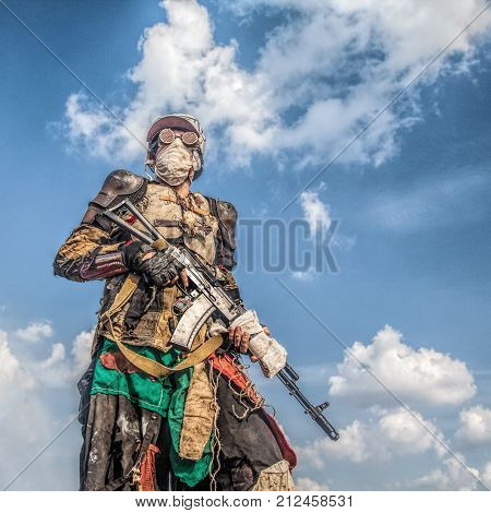 Post apocalyptic survivor creature with homemade weapons