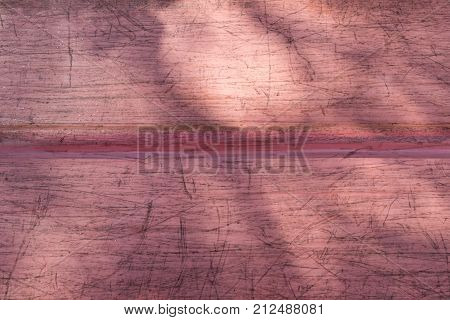 Used canoe bottom with sunlight and shadows for background