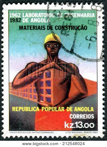 ANGOLA - CIRCA 1982: A stamp printed in Angola dedicated to 20th Anniversary of the Engineering Laboratory of Angola shows a construction worker circa 1982
