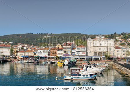 Istanbul Turkey - April 27 2017: View of Burgazada island from the sea with summer houses and a small mosque. the island is the third largest one of four islands named Princes' Islands in the Sea of Marmara near Istanbul Turkey