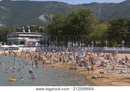 Gelendzhik, Krasnodar region, Russia - July 17, 2015: Lots holiday makers at the city beach resort of Gelendzhik