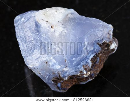 Rough Crystal Of Blue Chalcedony Gemstone On Dark