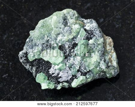 Rough Crystals Of Demantoid Gemstone On Dark