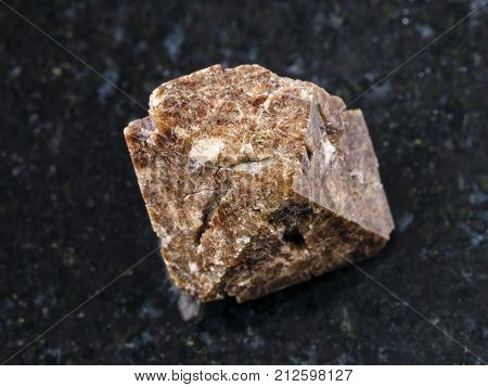 Raw Crystal Of Zircon Gemstone On Dark Background