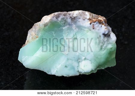 Rough Crystal Of Chrysoprase Gemstone On Dark