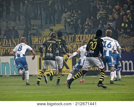 SOLNA SWEDEN - OCT 30 2017: Rear view of soccerplayer fighting to get the ball in the game AIK and IFK Gothenburg. October 30 2017SolnaSweden