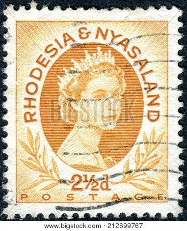 RHODESIA AND NYASALAND - CIRCA 1956: A stamp printed in Federation of Rhodesia and Nyasaland shows a portrait of Queen Elizabeth II circa 1956