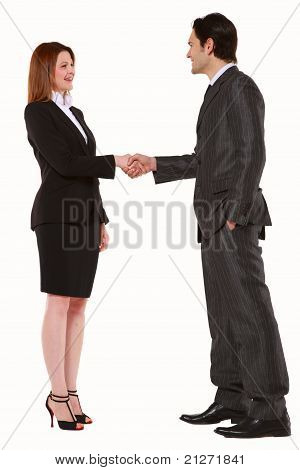businessman and businesswoman shaking hands standing in white background