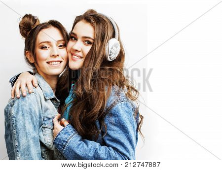 best friends teenage girls together having fun, posing emotional on white background, besties happy smiling, lifestyle people concept close up. making selfie