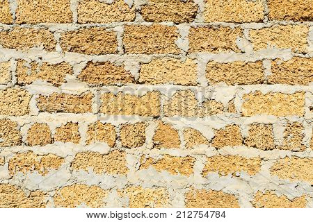 Wall Building Stone Limestone Seven Rows Yellow Closeup With A Big Cement Layer