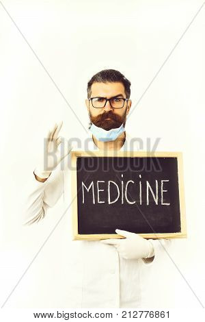 Bearded Caucasian Doctor Holding Syringe And Board With Medicine Inscription