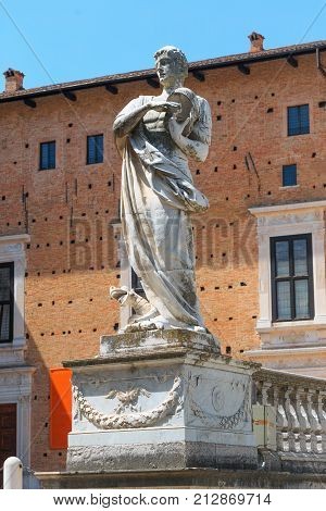 Urbino, Italy - August 9, 2017: The Cathedral. Piazza Duca Federico. Sculpture And Statue In Archite