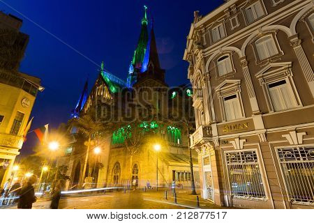 MANIZALES COLOMBIA - MAY 30: Traffic passes by the Cathedral Basilica of our Lady of the Rosary during the blue hour in Manizales Colombia on May 30 2016.