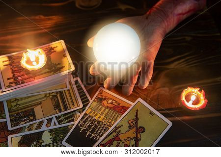 Tarot Cards And Crystal Ball Reading Psychic By Zombie Hand With Candlelight Well As Divination