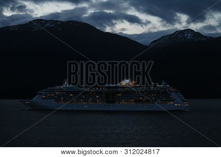 Sitka, Alaska/united States - 05/23/2107:  Royal Caribbean Cruise Ship At Night Cruising Along The A