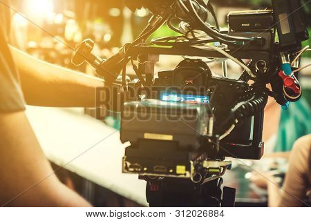 Behind The Scene. Cameraman Shooting Film Scene With Camera