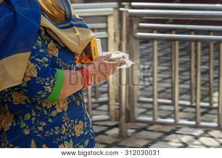 Deshnok, India - February 11, 2019: People Carry Offerings Food For Rats In Karni Mata Temple Or Rat
