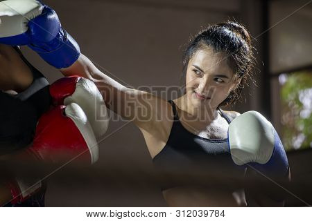 Boxing Woman Prepare To Trianing Session And Kickboxing,workout At Thai Boxing Gym.fit Female Exerci