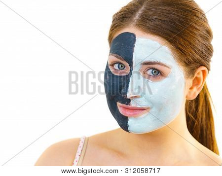 Girl With Black White Mud Mask On Face