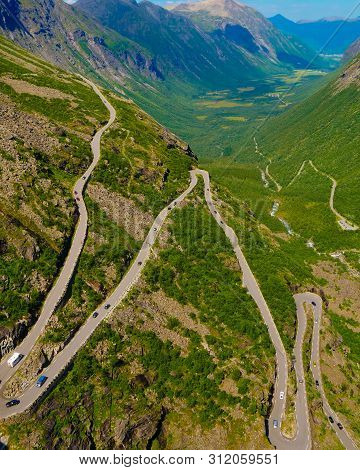 Trolls Path Trollstigen Winding Scenic Mountain Road With Many Cars, Norway Europe. National Tourist