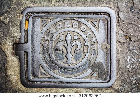 Florence, Italy - May 10, 2018: Old Shabby Manhole In Florence