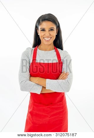 Portrait Of A Happy Attractive Woman Wearing A Red Apron Making Thumb Up Gesture