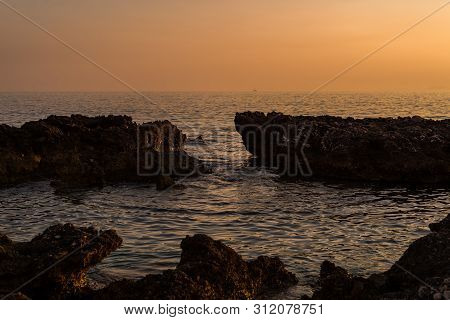 Beautiful Sunset With Rocks In The Adriatic Sea, Dingac Borak, Dalmatia, Croatia, Peljesac Peninsula