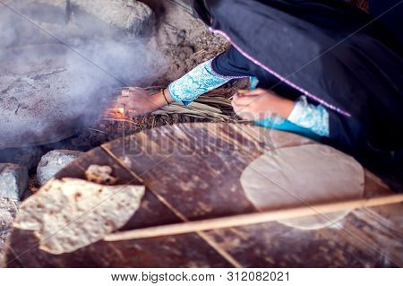 Arab Woman Makes Bread In The Beduin Village In Egypt