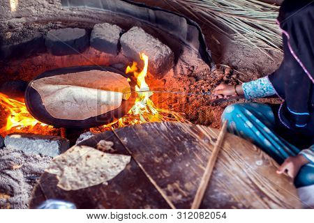 Arab Woman Makes Bread In The Beduin Village In Egypt