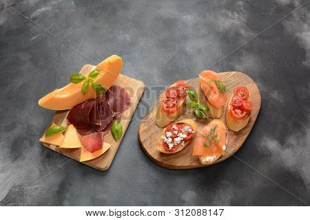 Brushetta Or Traditional Spanish Tapas. Appetizers With Italian Antipasti Snacks. Variety Of Small S