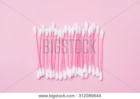 Pink Cotton Buds On Pink Background. Selective Focus Copy Space.