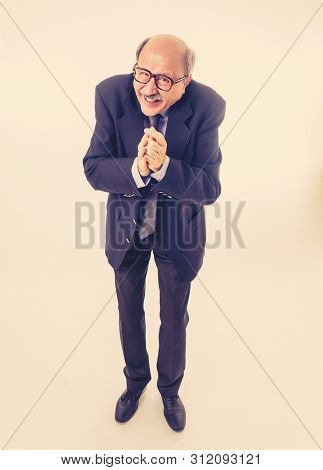 Portrait Of Last Day At Work Of Happy Senior Businessman Excited About His Retirement