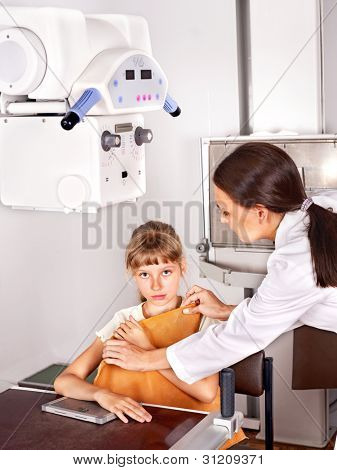 Little girl with doctor radiologist.
