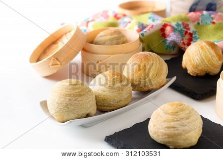 Oriental Food Concept Homemade Organic Huaiyang Spiral Chinese Flaky  Pastry Moon Cake On White Back