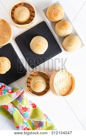 Oriental Food Concept Homemade Organic Huaiyang Spiral Chinese Flaky  Pastry Moon Cake On White Back