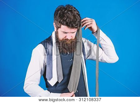 Hard Choice To Make. Bearded Man Choosing Tie From Luxury Collection, Choice Concept. Salesman Offer