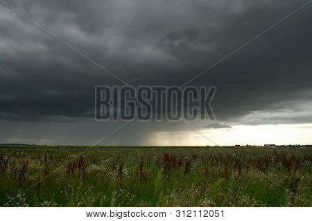 Beautiful storm sky with clouds and field, apocalypse, tunder, tornado