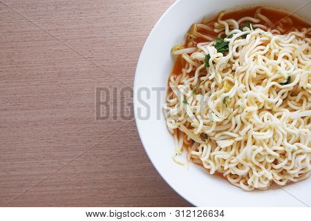 Close Up Dry Tomyum Noodle On Wooden Table