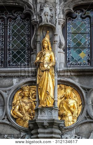 Bruges, Flanders, Belgium -  June 17, 2019: Detail With Golden Noblity Statues Of Facade Of Basilica