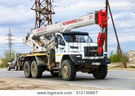 Novyy Urengoy, Russia - June 25, 2019: Off-road Truck Chassis Ural 4320 Next Mounted Mobile Crane Ch