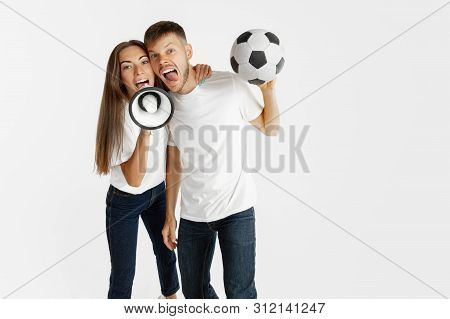 Portrait Of Beautiful Young Couple Football Or Soccer Fans On White Studio Background. Facial Expres
