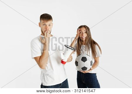 Portrait Of Beautiful Young Couple Football Or Soccer Fans On White Studio Background. Facial Expres