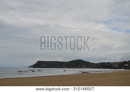 Wonderful Beach On A Cloudy Day In Comillas. August 26, 2013. Comillas, Cantabria. Holiday Nature St
