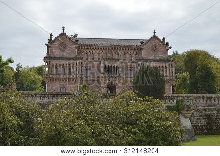 Main Facade Of Sobrellano Palace On A Cloudy Day In Comillas. August 26, 2013. Comillas, Cantabria. 